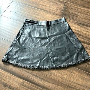 GILBERT vegan leather skirt with woven grommet detail
